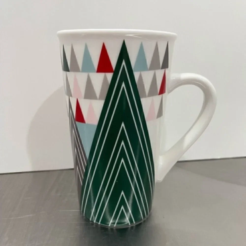 Starbucks tall white ceramic mug! Decorated with geometric, triangular Christmas
